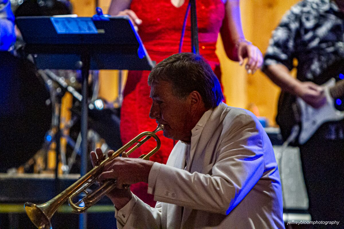 A Soulcats band member playing the trumpet